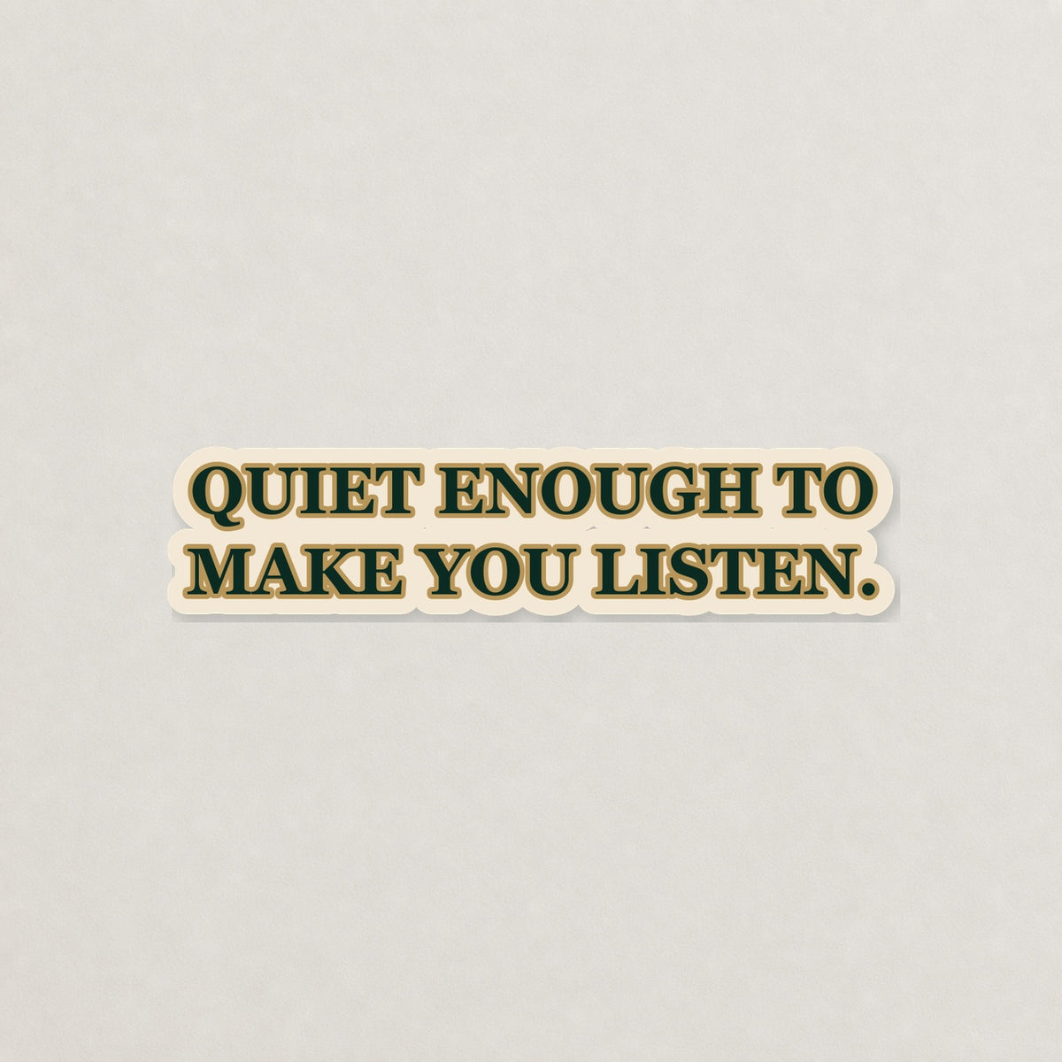 Quiet Enough to Make You Listen Lettering Sticker on a neutral studio background