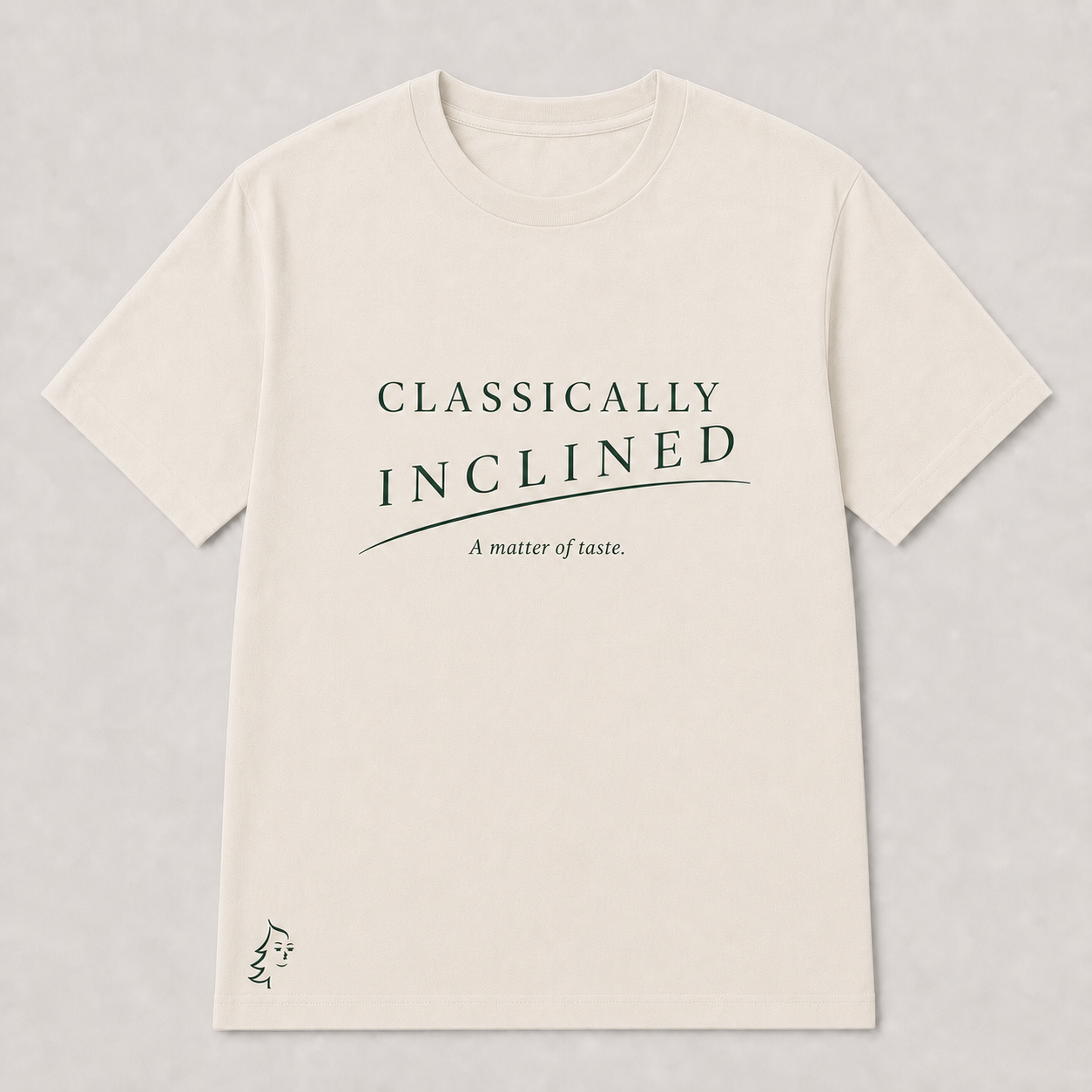 Classically Inclined Minimal T-Shirt in Warm Ivory with deep forest typography, phrase slur, A matter of taste subtitle, and Sprucely mark