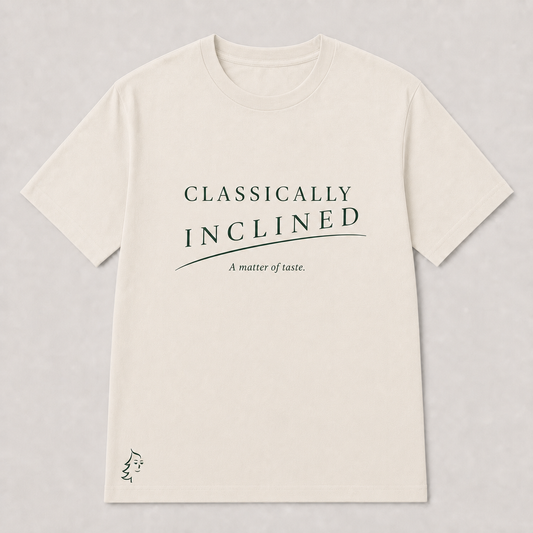 Classically Inclined Minimal T-Shirt in Warm Ivory with deep forest typography, phrase slur, A matter of taste subtitle, and Sprucely mark