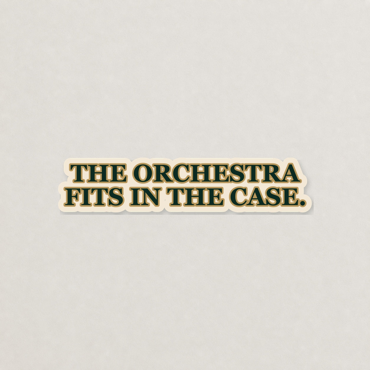 The Orchestra Fits in the Case Lettering Sticker on a neutral studio background