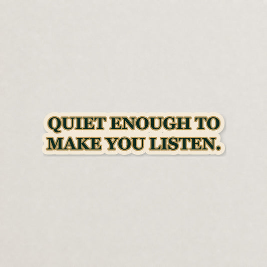 Quiet Enough to Make You Listen Lettering Sticker on a neutral studio background